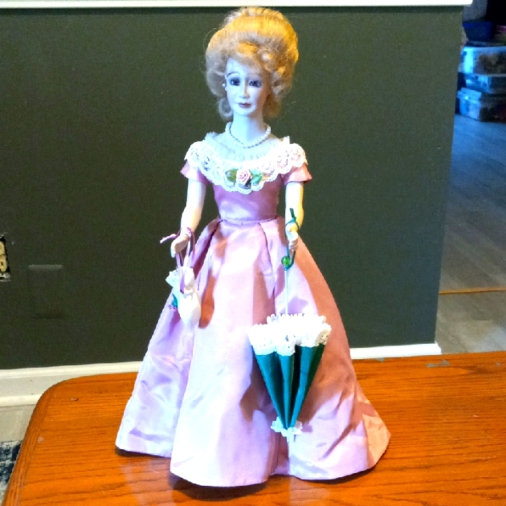 Elegant Pink Porcelain Doll with Umbrella